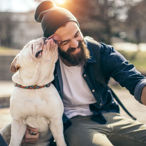 Man and his dog best friend hanging out taking a selfie together near Bristol House in Washington, District of Columbia