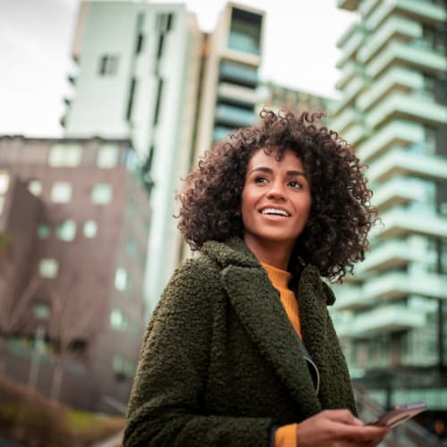Woman admiring the gorgeous neighborhood she lives in near Dorchester West in Washington, District of Columbia