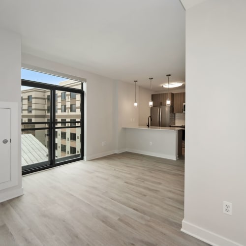 Open concept living room with a gorgeous view of the city at Madrona Apartments in Washington, District of Columbia