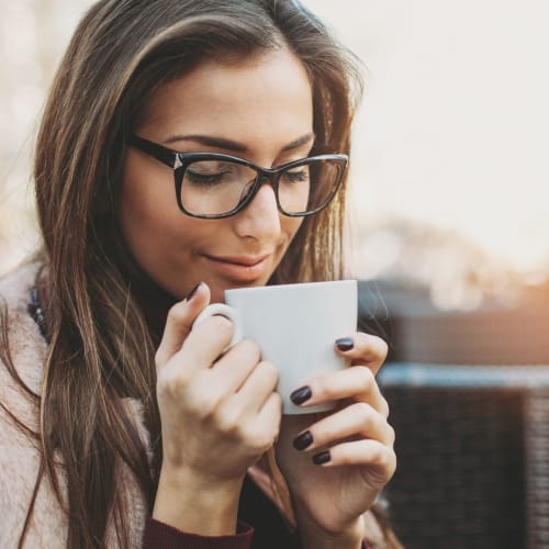 Woman sipping a hot cup of tea to start her morning off right at The Corcoran in Washington, District of Columbia