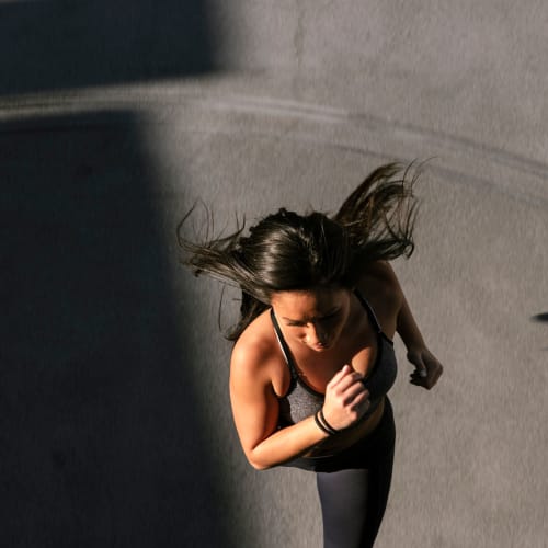 a woman on a jog at Stone Park in Lemoore, California