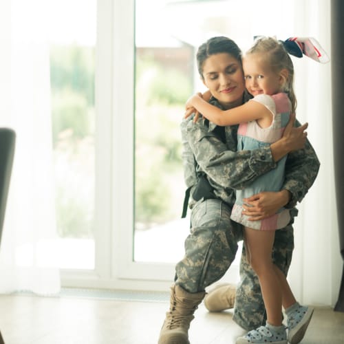 a resident embracing her daughter at Santa Rosa in Point Mugu, California