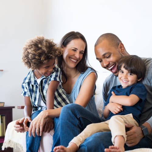 a family laughing together at Santa Rosa in Point Mugu, California