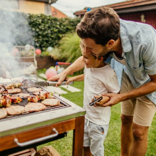 a father and son barbequing at Copper Canyon in Twentynine Palms, California