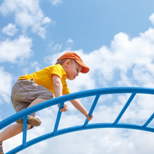 a kid on a playground at Bellevue in Washington, District of Columbia