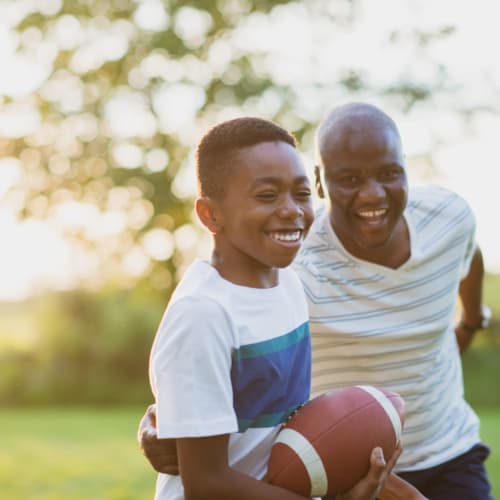 a father and son playing football at 16th Street in Yuma, Arizona