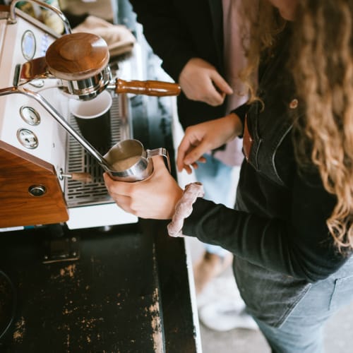 A barista steaming milk at Stanley Court in Portsmouth, Virginia