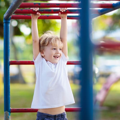 a boy on a playground at North Severn Village in Annapolis, Maryland