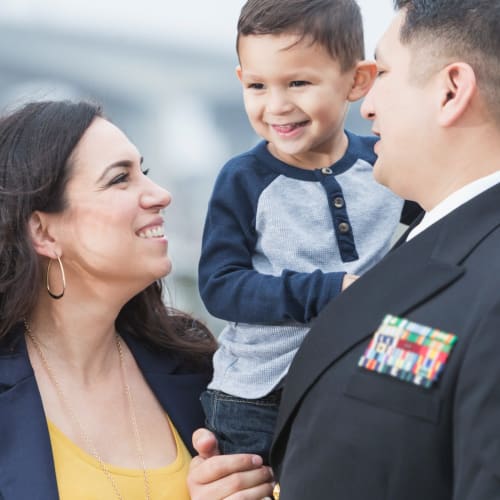 a resident family smiling together at North Severn Village in Annapolis, Maryland