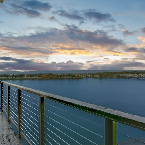 Sunset View of the Columbia River from an apartment balcony at The Columbia at the Waterfront in Vancouver, Washington