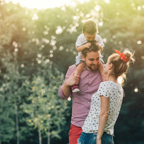 resident family laughing in the sun at River Place in Lakeside, California