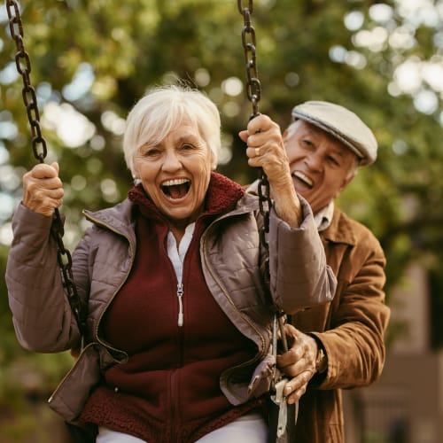 a couple residents on the swings at Capeharts in Ridgecrest, California