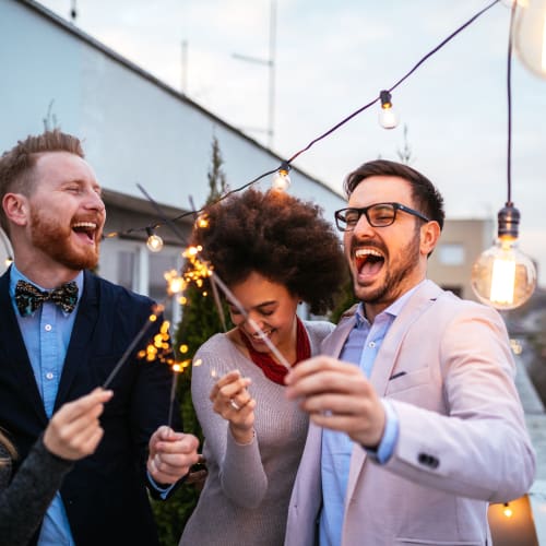 residents outside with sparklers at Forster Hills in Oceanside, California