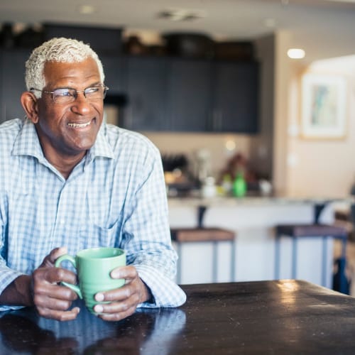 a resident enjoying his coffee at Sea Breeze Village in Seal Beach, California