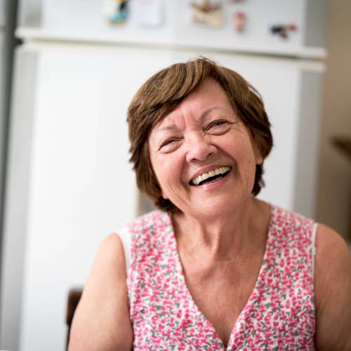 a smiling senior resident at Sunflower Terrace in Twentynine Palms, California