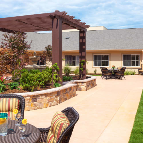 Concrete patio outside at Saddlebrook Oxford Memory Care in Frisco, Texas