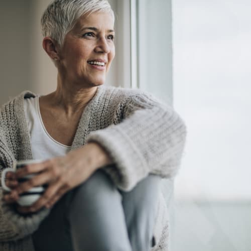 a resident enjoying some coffee at home at Port Lyautey in Virginia Beach, Virginia