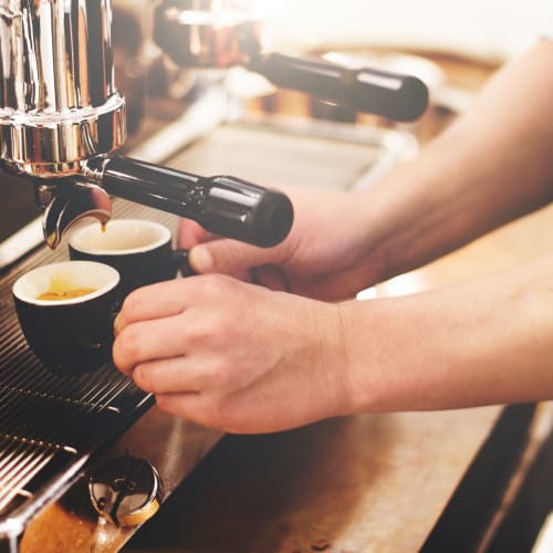 a barista making some espresso near The Village at New Gosport in Portsmouth, Virginia