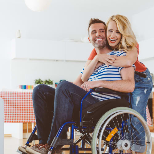 two residents in a hugging embrace at Longshaw Road in Annapolis, Maryland