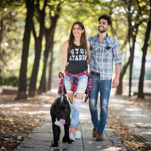 a couple walking their dog at Longshaw Road in Annapolis, Maryland