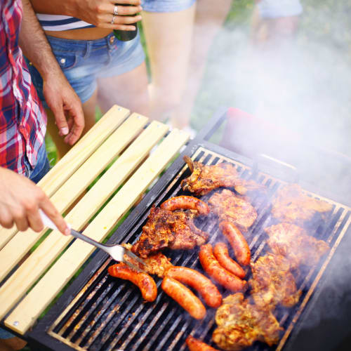 a grill with lots of meat on it at Foxville Gardens in Sabillasville, Maryland