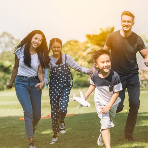 a family outside on the grass at Riverview Village in Indian Head, Maryland