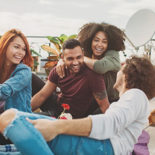 a group of residents laughing together at Riverview Village in Indian Head, Maryland