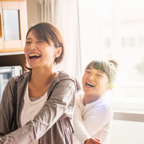 a mother and daughter laughing at Davis Hill in Joint Base Lewis McChord, Washington