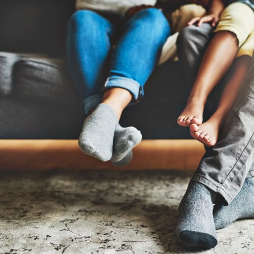 a family's feet at Terrace View Villas in San Diego, California