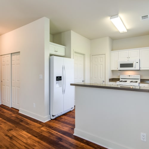 a kitchen and hallway at Del Mar I in Oceanside, California