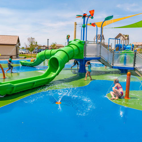Outdoor splash park with water slide and kids playing  Blue Sky in Fallon, Nevada