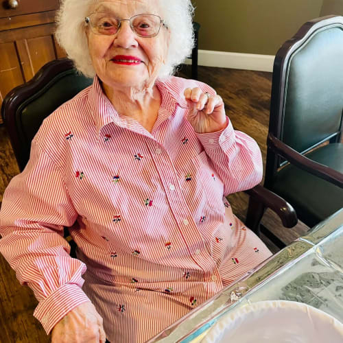 Resident hugging a younger family member at Riverside Oxford Memory Care in Ft. Worth, Texas