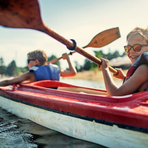 two kids on kayaks exploring and having fun  Echelon at Odenton in Odenton, Maryland