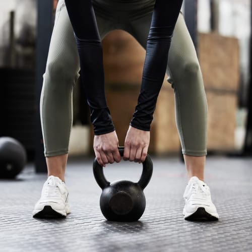 Resident doing a kettlebell workout at The View North Hills in Pittsburgh, Pennsylvania