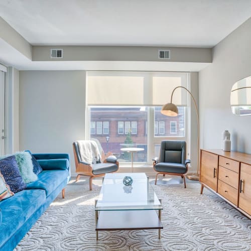 Spacious living room with huge windows at Ceylon in Clayton, Missouri
