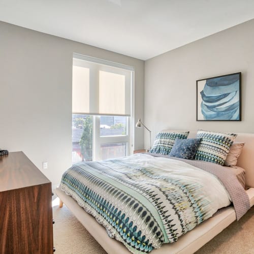 Model bedroom with large window at Ceylon in Clayton, Missouri