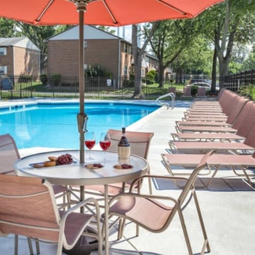 Poolside lounge chairs and tables at Fox Pointe, Hi-Nella, New Jersey