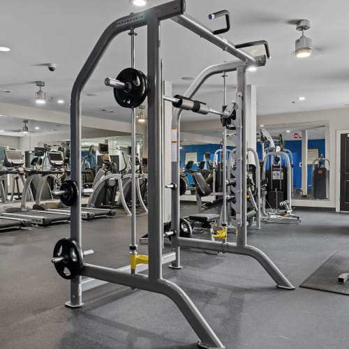 Assisted weight machines with cardio machines in background in fitness room at Marq Eight in Atlanta, Georgia