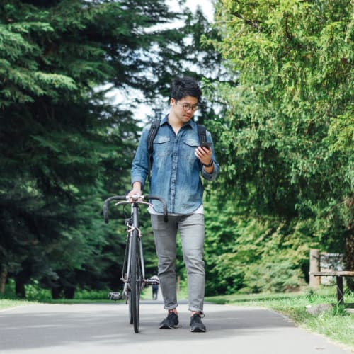 Man with his bicycle at Solaire 1150 Ripley in Silver Spring, Maryland