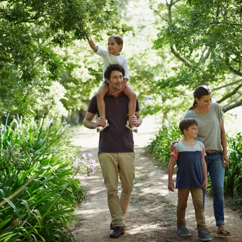 Family walking in nature at Solaire 1150 Ripley in Silver Spring, Maryland