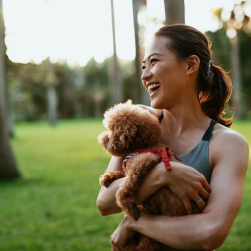 Resident holding her dog at The Meridian South, Indianapolis, Indiana