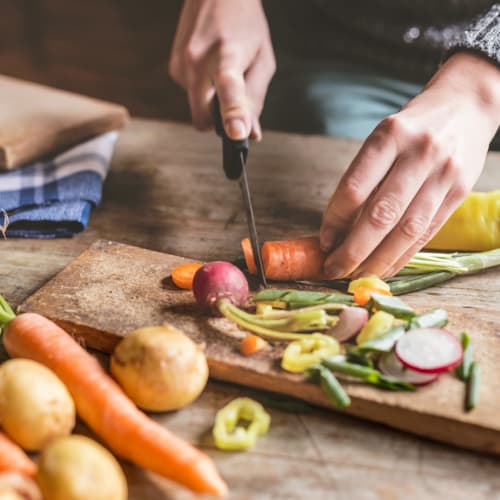 Resident preparing a meal in their new kitchen at The Wellington, Hatboro, Pennsylvania