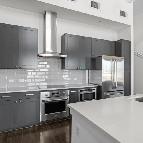 Kitchen with stainless-steel appliances at Marq Music Row in Nashville, Tennessee
