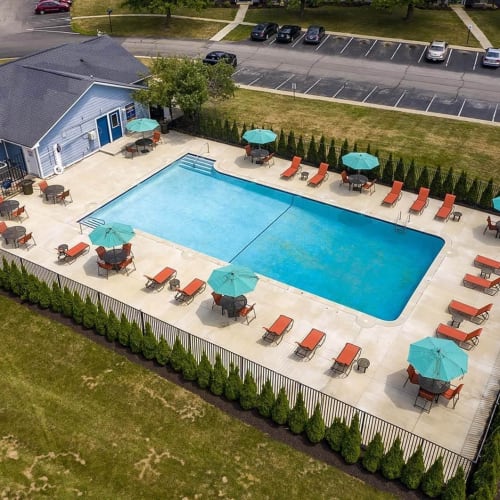 Pool with lounge chairs and tables at The Meridian South, Indianapolis, Indiana
