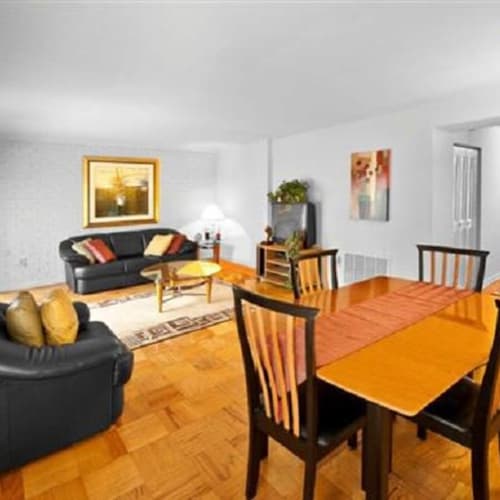 Apartment dining room with a square table set for four at Towne Crest in Gaithersburg, Maryland