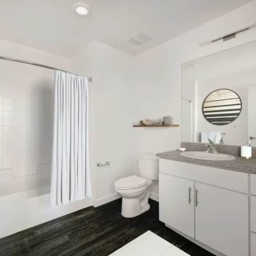 Bathroom with mirror at 353 Main Street Family Apartments in Redwood City, California