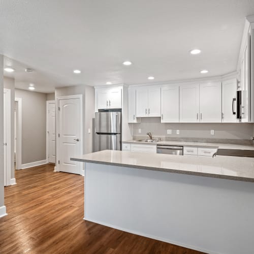 Modern kitchen with a breakfast bar at Vista Creek Apartments in Castro Valley, California