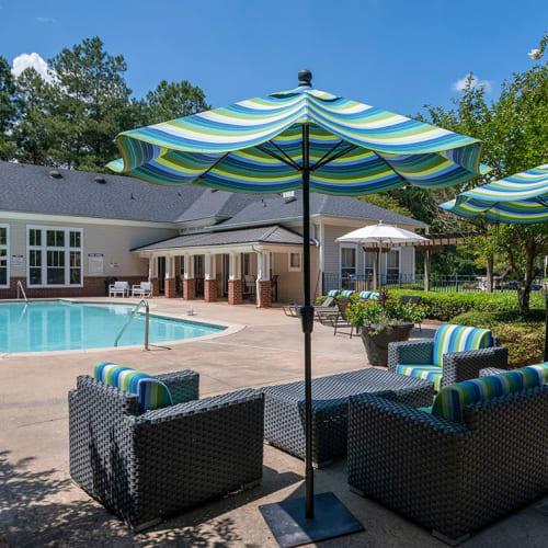 Covered seating beside the pool at The Glen at Lanier Crossing in Stockbridge, Georgia