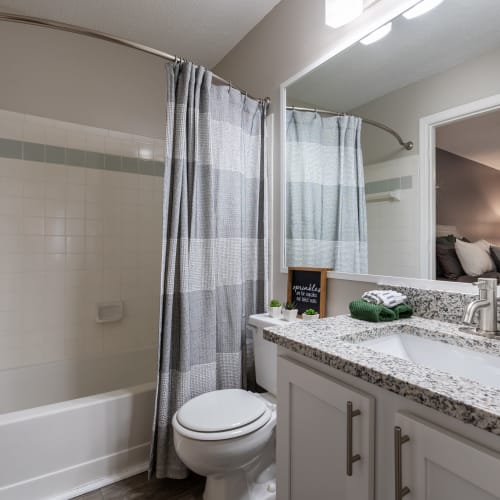 An apartment bathroom with a full-sized bathtub at Granby Crossing in Cayce, South Carolina