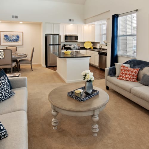 An apartment living room, dining room and kitchen at Cottages at Emerald Cove in Savannah, Georgia
